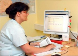 A project team member enters anonymised patient data from the questionnaire on...