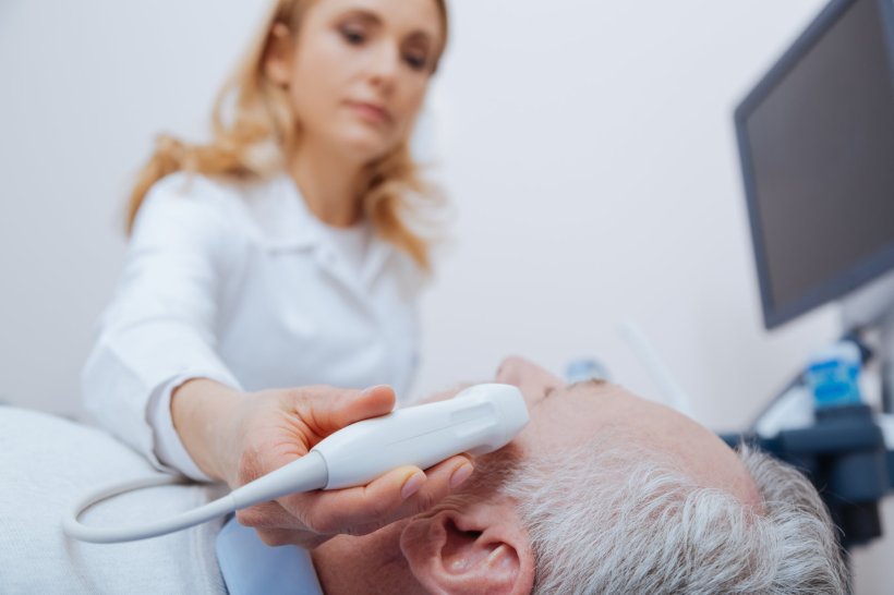 ultrasound exam of an elderly patients head