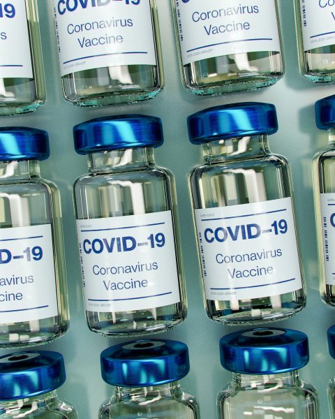 covid-19 vaccine bottles with blue caps